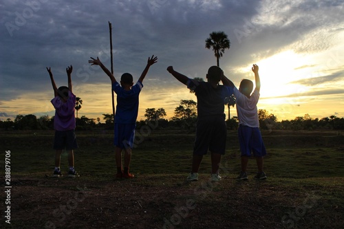 Children travel adventures in the jungle with fun, golden yellow light at sunset