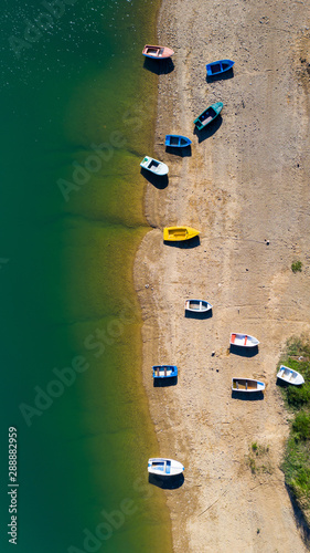 Aerial view of boats on the beach. Lokve lake in Croatia. © xMarshall