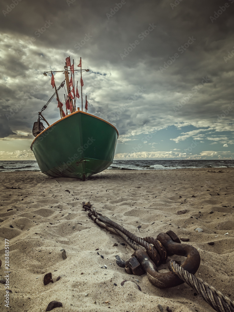 Fish cutter moored at the sandy beach - obrazy, fototapety, plakaty 