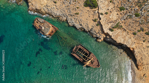 Aerial drone photo of old abandoned rusty shipwreck near area of Kalotaritissa, Amorgos island, Cyclades, Greece photo