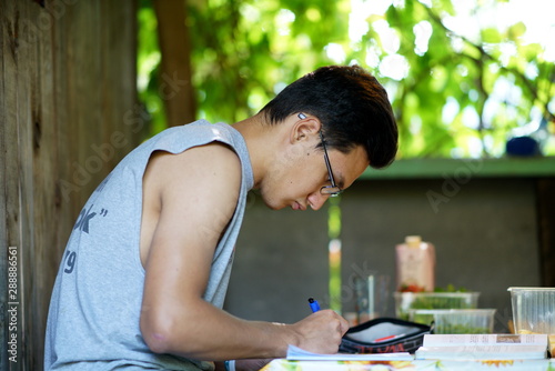 Plakat The boy learning outdoors, wrighting