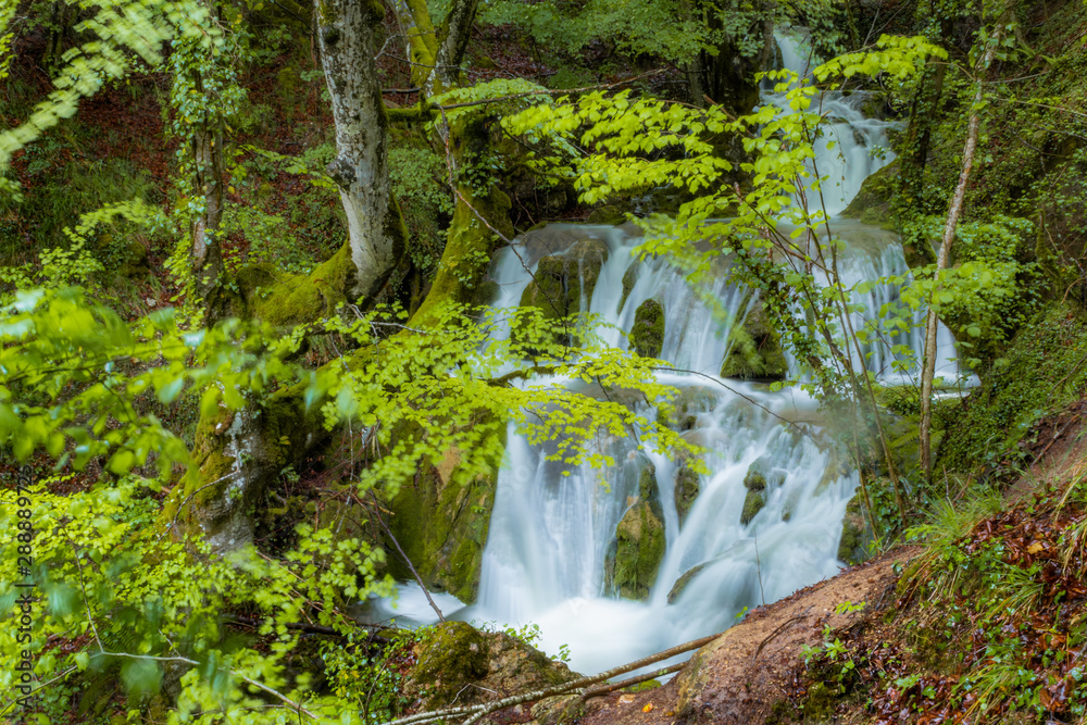 Naklejka premium great fluidity of water in the Tobera waterfalls, in the Basque country