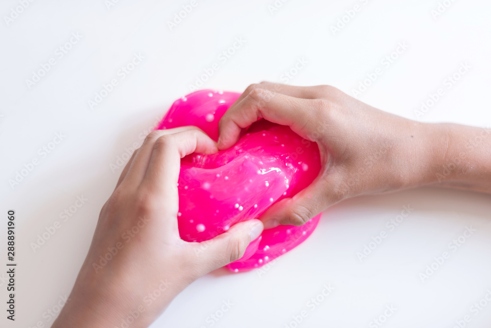 child play with hand made toy called slime child play with hand made toy called slime