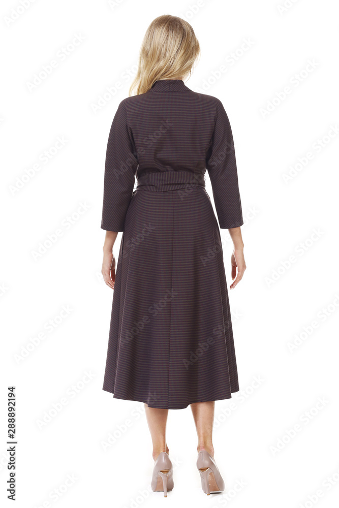 blond young business woman executive posing in designer formal long official woolen gray slit dress blond young business woman executive posing in designer formal long official woolen gray slit dress