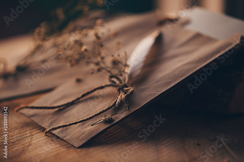Paper book. Old paper. Wooden background.  © Erika