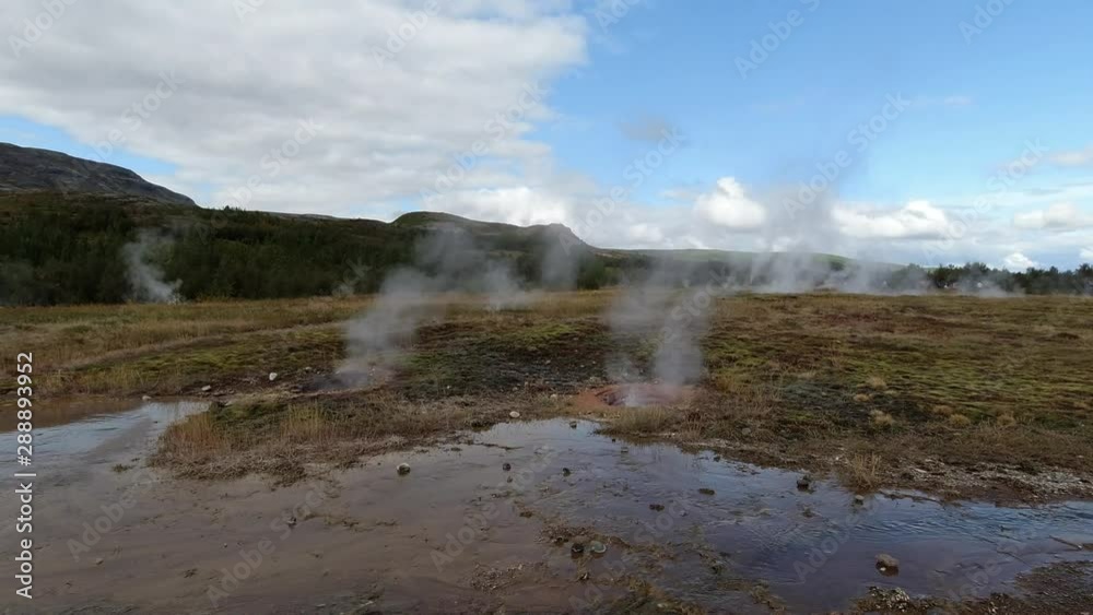 A group of small boiling geysers with steam rising to the sky in Iceland. Filmed in SlowMo. No camera movements. A group of small boiling geysers with steam rising to the sky in Iceland. Filmed in SlowMo. No camera movements.