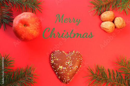 red christmas greeting card with a gingerbread heart and text