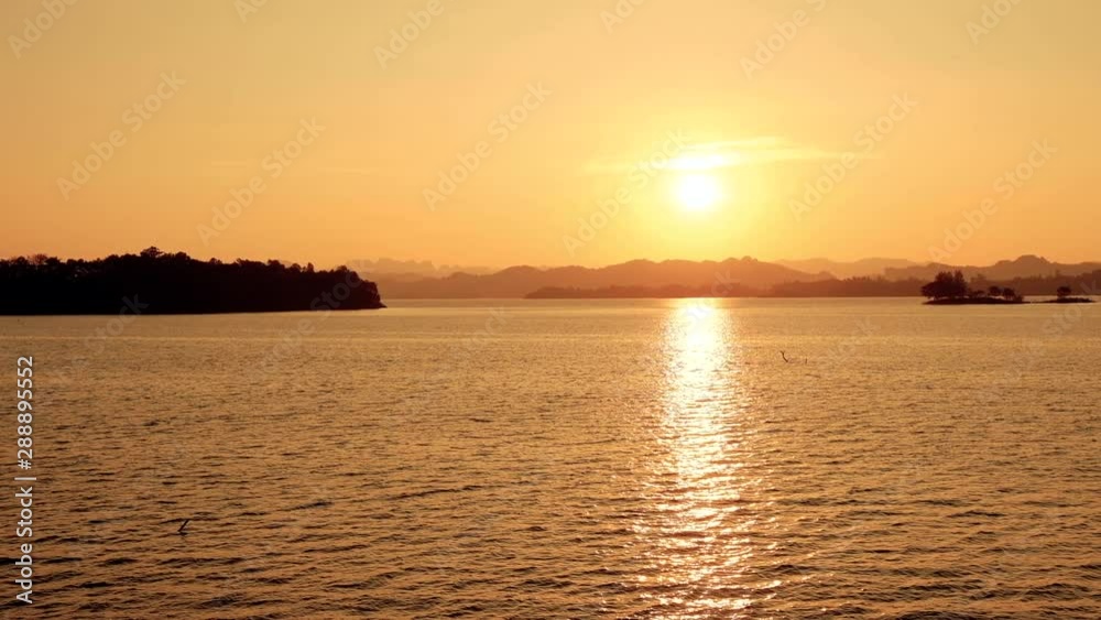 Stock video Golden evening sun on lake , sky colors in sunset time,relax time Stock video Golden evening sun on lake , sky colors in sunset time,relax time