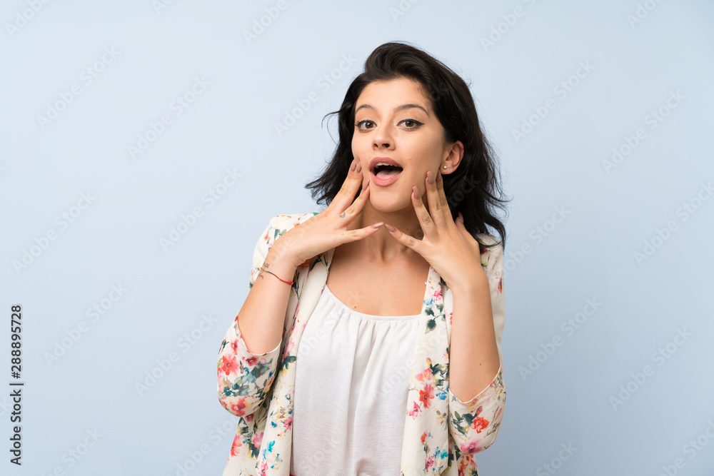 Young woman over isolated blue background with surprise facial expression Young woman over isolated blue background with surprise facial expression