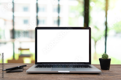 Desk Laptop with blank screen on table blur background with bokeh background