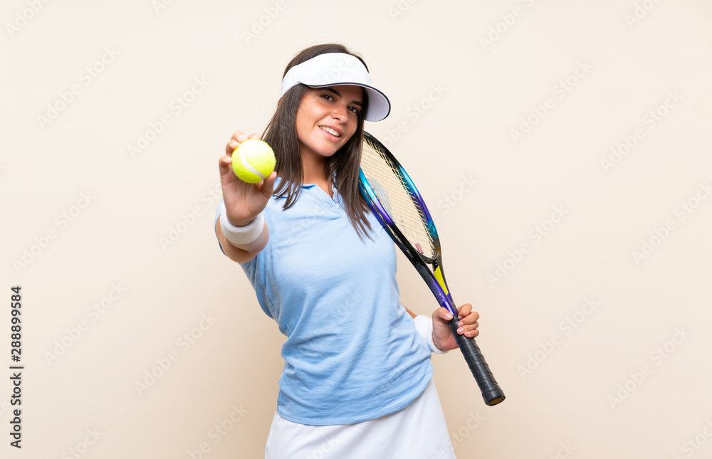 Young woman playing tennis over isolated background Young woman playing tennis over isolated background