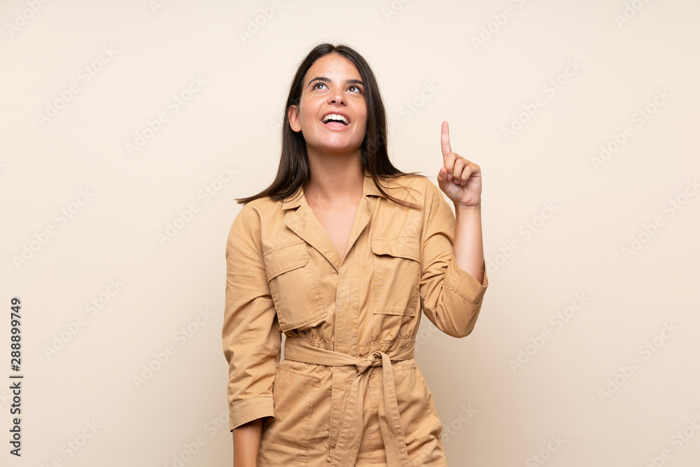 Young girl over isolated background pointing up and surprised Young girl over isolated background pointing up and surprised