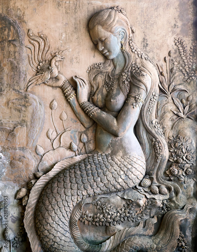 Stucco female mermaid figure is a beautiful work of art photo