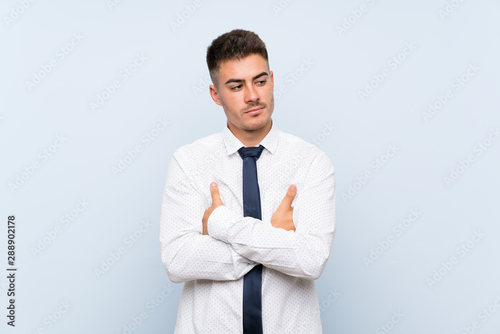 Handsome businessman over isolated blue background thinking an idea Handsome businessman over isolated blue background thinking an idea
