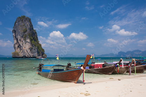 Traditional Thai boats on the beach at Poda island , Thailand