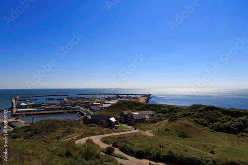 The sea, the port and the red cross post photo