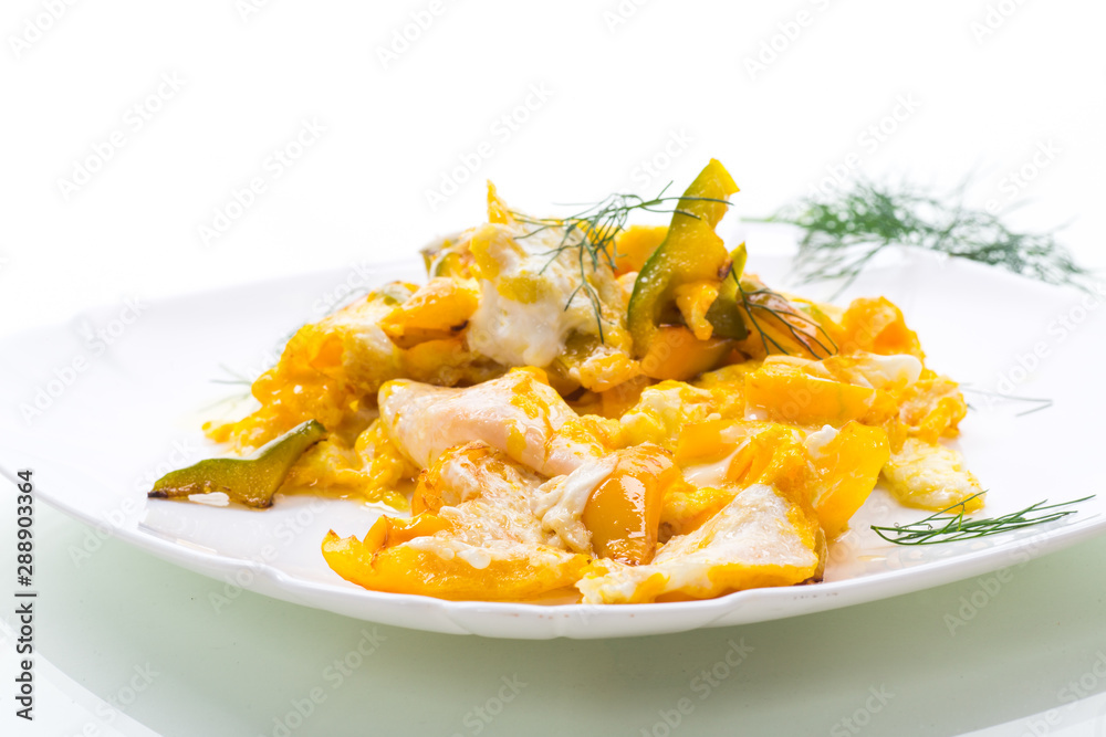 fried omelet from homemade eggs with sweet yellow pepper in a plate fried omelet from homemade eggs with sweet yellow pepper in a plate