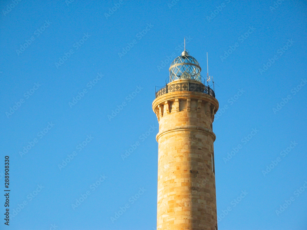 Lighthouse tower and blue sky, Chipiona, Spain.