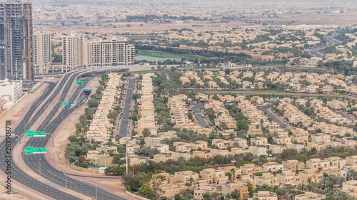 Aerial view of apartment houses and villas in Dubai city timelapse, United Arab Emirates