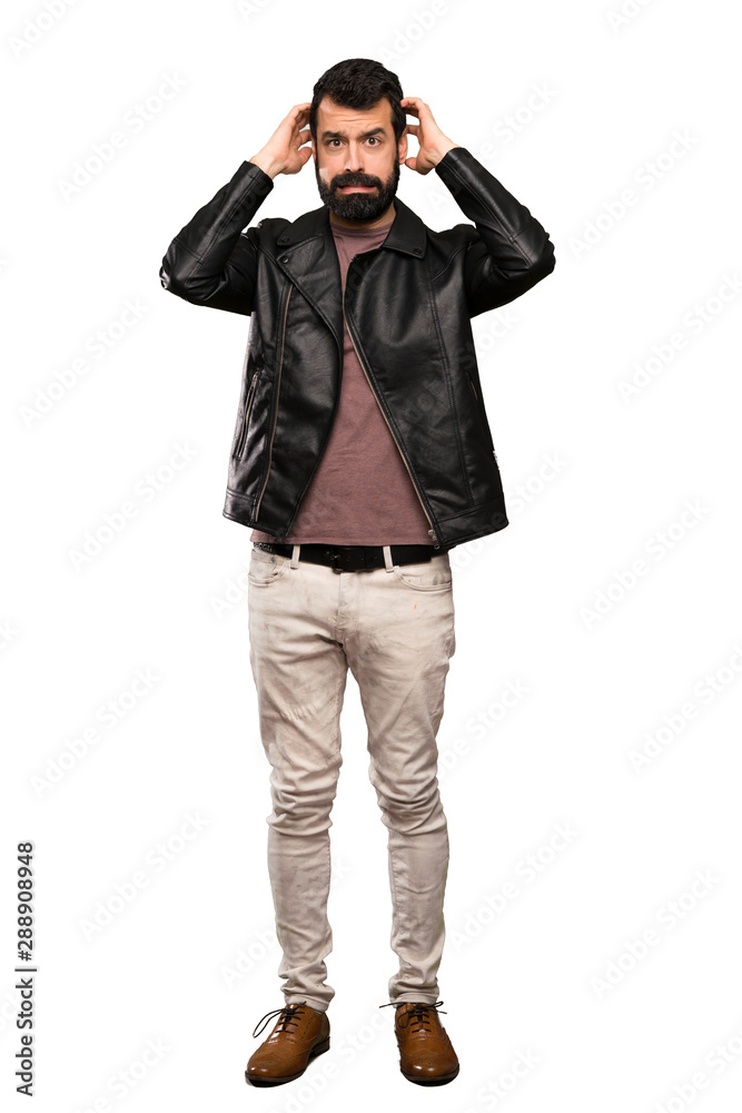 Handsome man with beard frustrated and takes hands on head over isolated white background Handsome man with beard frustrated and takes hands on head over isolated white background