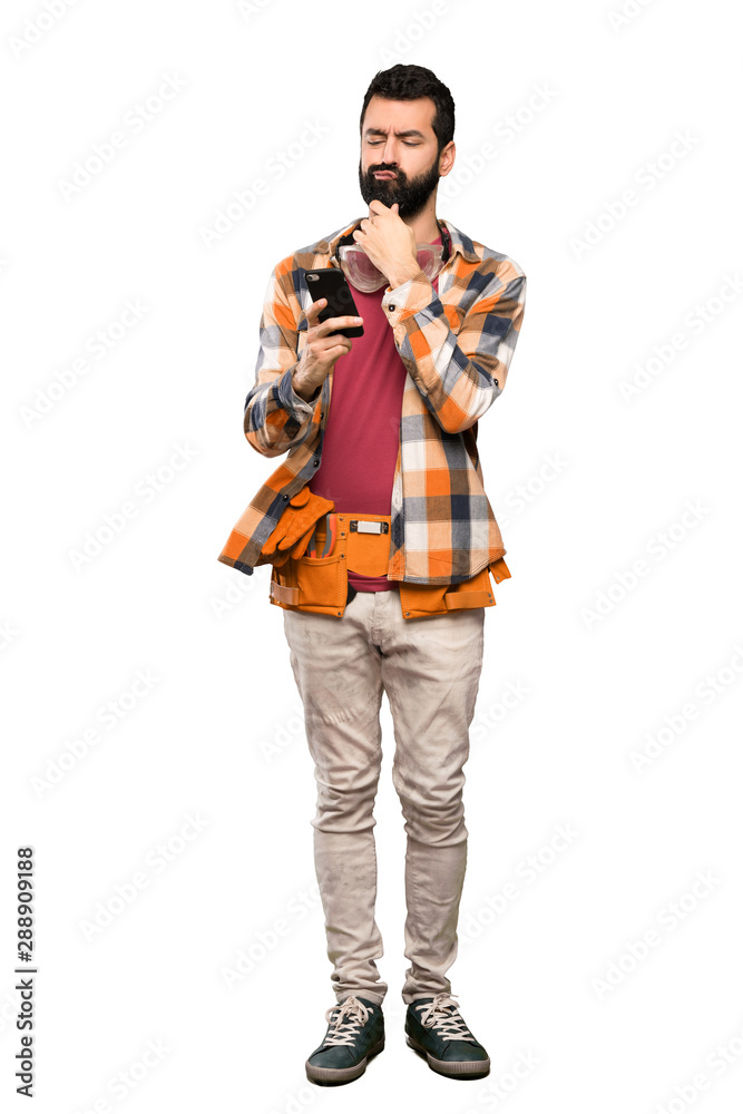 Craftsmen man thinking and sending a message over isolated white background Craftsmen man thinking and sending a message over isolated white background