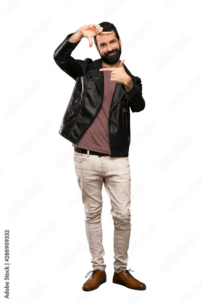 Handsome man with beard focusing face. Framing symbol over isolated white background Handsome man with beard focusing face. Framing symbol over isolated white background