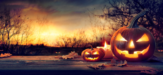 Jack O’ Lanterns In Spooky Forest With Ghost Lights - Halloween Background