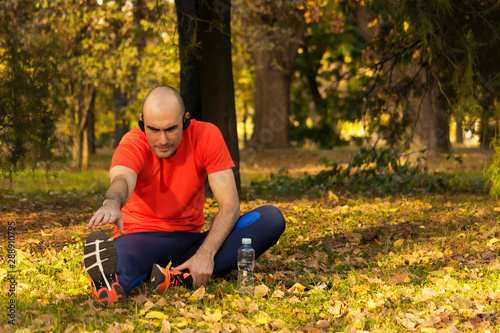 Stretching in park after hard workout