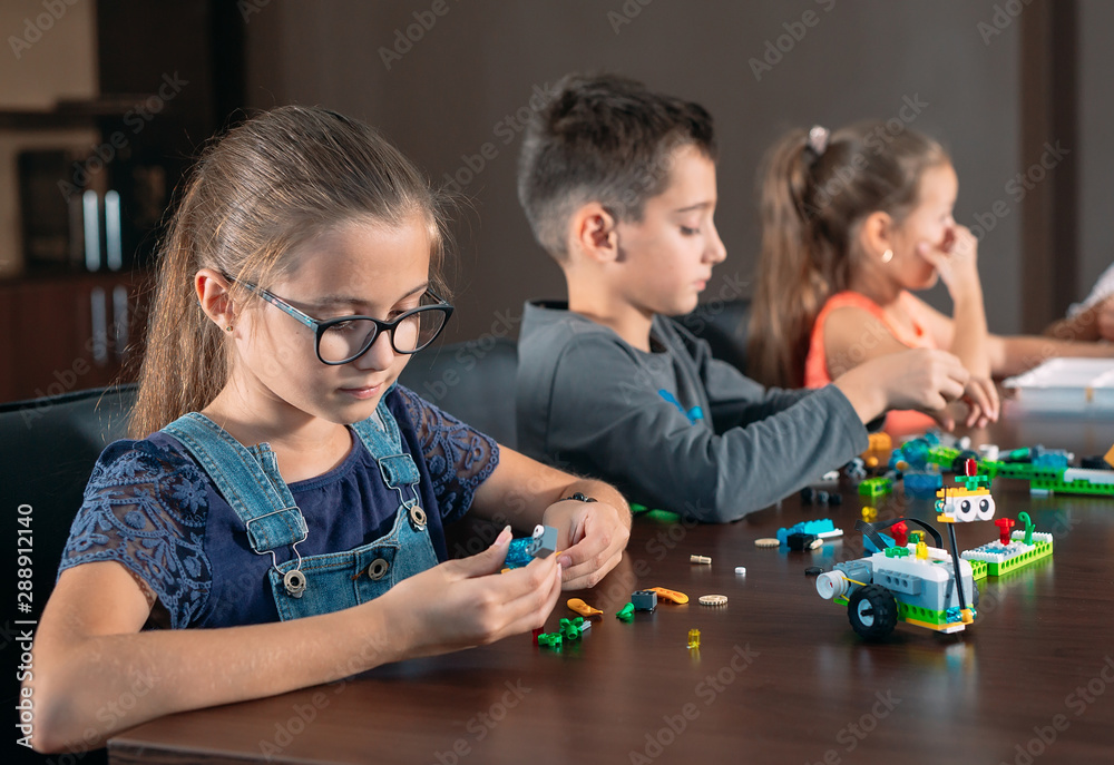 Children in the classroom collect figure from the designer. Children in the classroom collect figure from the designer.