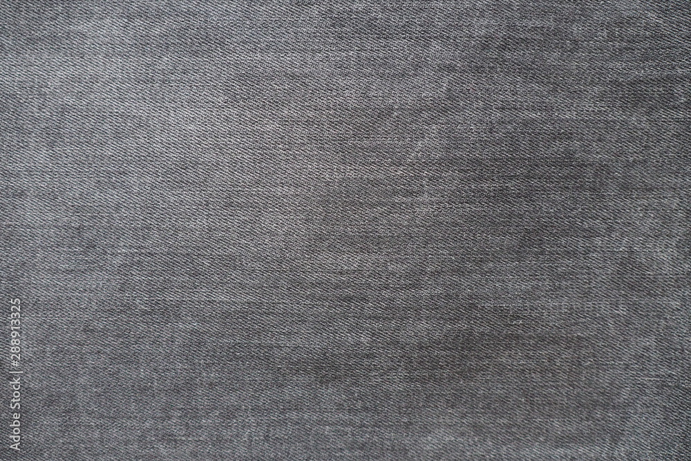 Closeup of black jeans fabric with texture and rough surface in black and white or gray vintage tone for background and decoration. Textile texture grunge wallpaper and cool banner in page and cover Closeup of black jeans fabric with texture and rough surface in black and white or gray vintage tone for background and decoration. Textile texture grunge wallpaper and cool banner in page and cover