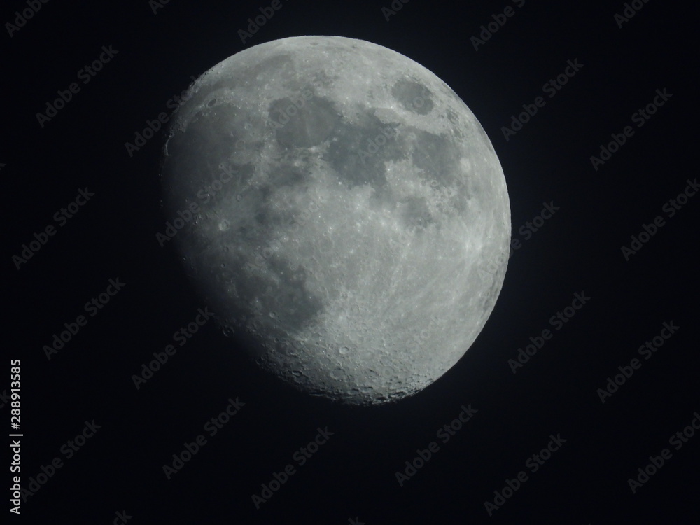 the moon is a celestial body, a satellite of the Earth, glowing with reflected sunlight. the moon is a celestial body, a satellite of the Earth, glowing with reflected sunlight.