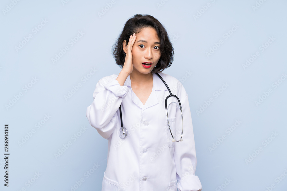 Doctor Asian woman with surprise and shocked facial expression Doctor Asian woman with surprise and shocked facial expression