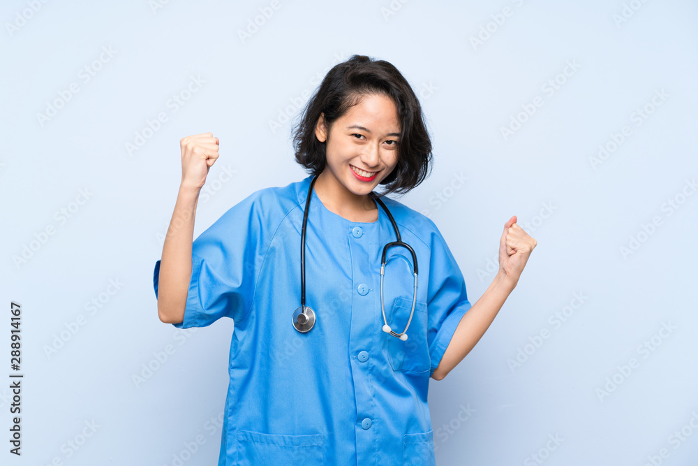 Surgeon doctor woman celebrating a victory Surgeon doctor woman celebrating a victory