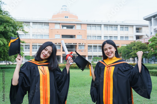 Young Asian woman university graduate celebrates with joyous and happiness after receiving university degree certificate in commencement ceremony. Congratulations graduate ceremony. Education Concept.