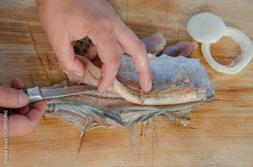 peeling bone marinated herring