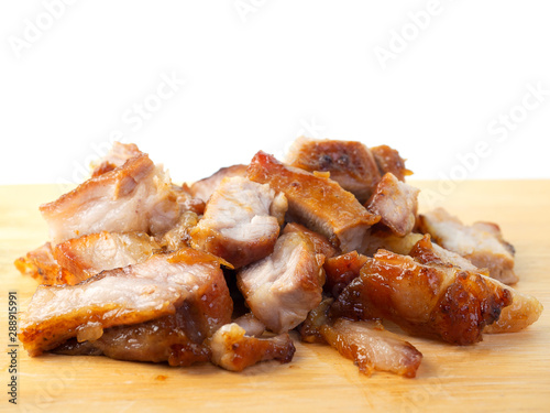 grilled pork chop on wooden board.