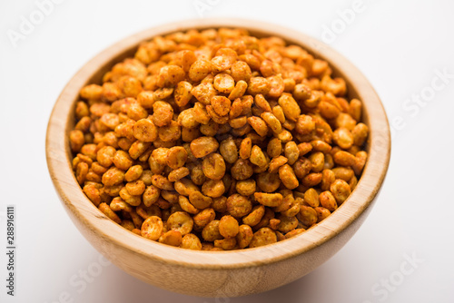 Fried and Spicy Chana Dal Masala is a popular Chakna recipe. served in a bowl. selective focus © Arundhati