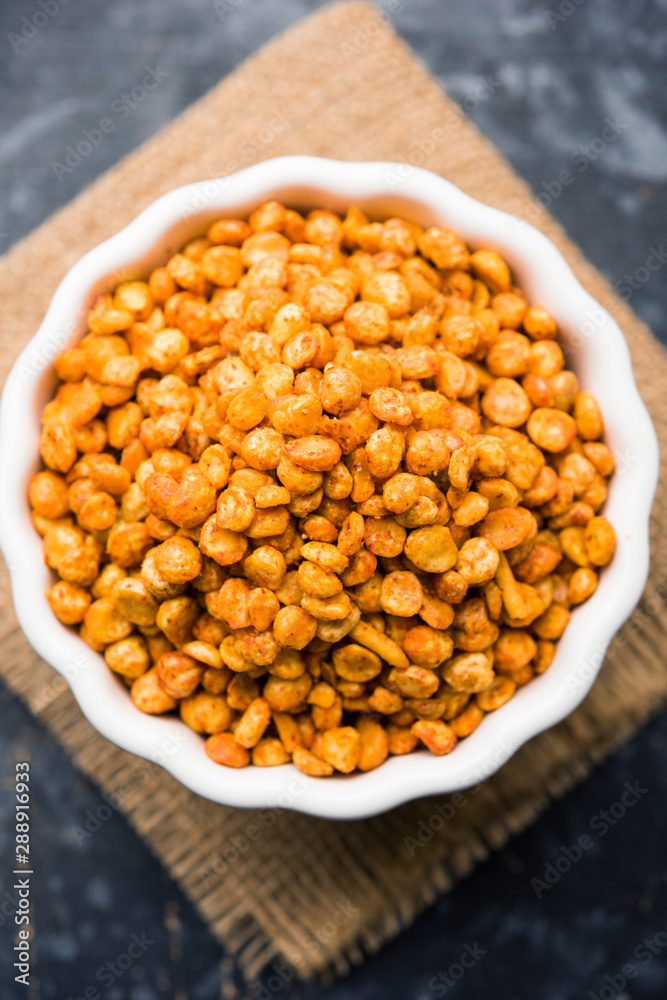 Fried and Spicy Chana Dal Masala is a popular Chakna recipe. served in a bowl. selective focus Fried and Spicy Chana Dal Masala is a popular Chakna recipe. served in a bowl. selective focus