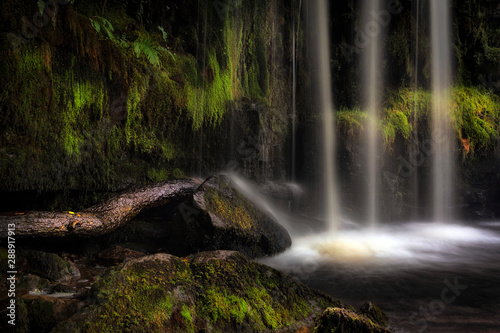 Long exposure detail of the moss covered waterfall at Sgwd Ddwli Isaf on the river Neath  near Pontneddfechan in South Wales  UK.