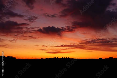 The silhouette of the city sunrise sky with clouds