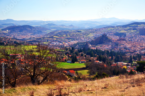 Принти на полотні Aiguilhe, France - March 30th 2019 : view of the small city Aiguilhe frond a field