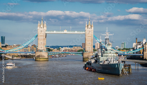Tower Bridge in London with a battle ship with river Thame.