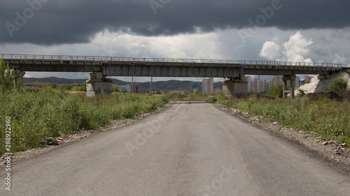 Tableau sur toile Bypass asphalt road and railway bridge