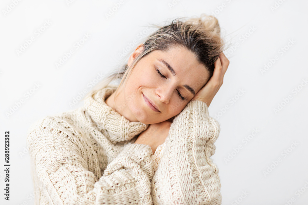 Close-up image of tender and gorgeous young woman dreaming expression with closed eyes, smiling from love and joy, over white background. Close-up image of tender and gorgeous young woman dreaming expression with closed eyes, smiling from love and joy, over white background.