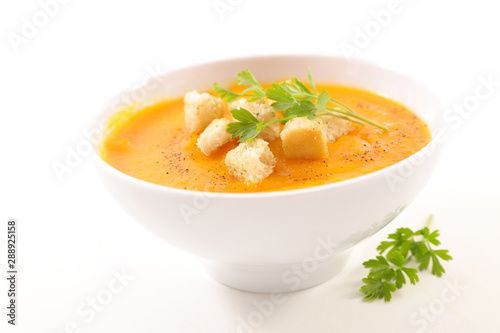 Εκτύπωση καμβά bowl of soup with crouton and parsley on white background