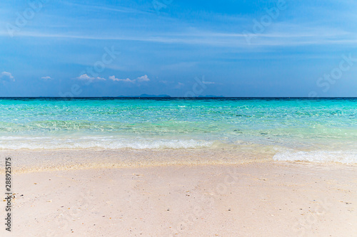 Empty sea and sand beach  nature  background bright sky and scene  The ocean with the foamy waves blowing towards the shore