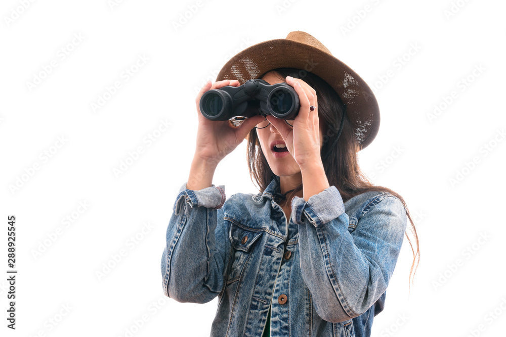 brunette scout girl with glasses dressed in denim jacket and hat, with binoculars surprised isolated brunette scout girl with glasses dressed in denim jacket and hat, with binoculars surprised isolated