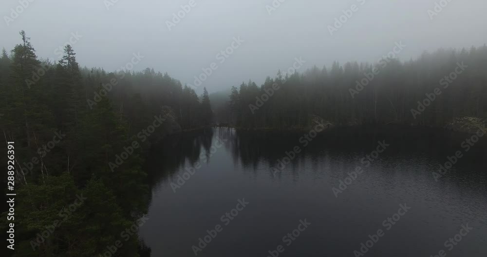 An aerial view of misty lakes and forests of Fiskars in Finland An aerial view of misty lakes and forests of Fiskars in Finland