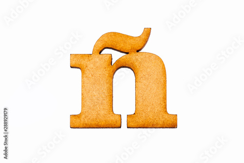 Lowercase letter ñ in wood - White background photo