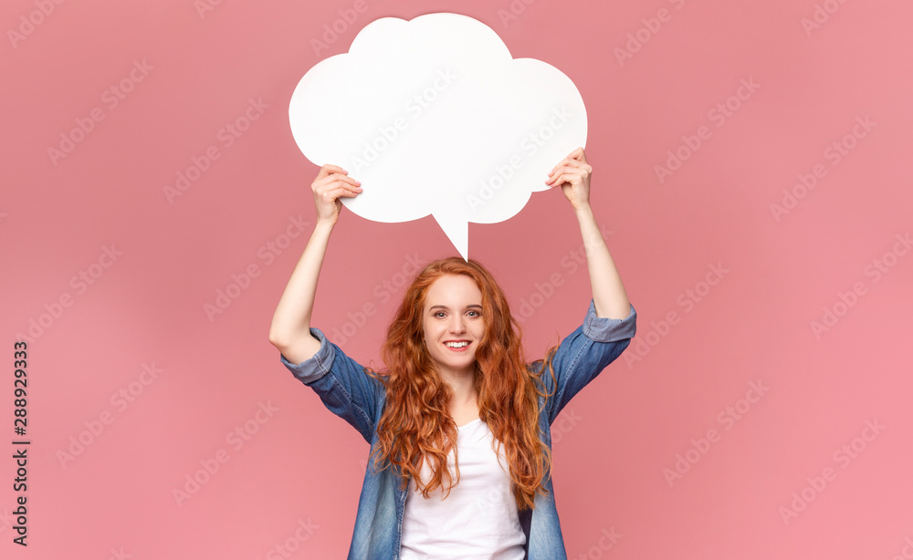 Blank speech bubble above happy millennial redhead girl's head Blank speech bubble above happy millennial redhead girl's head